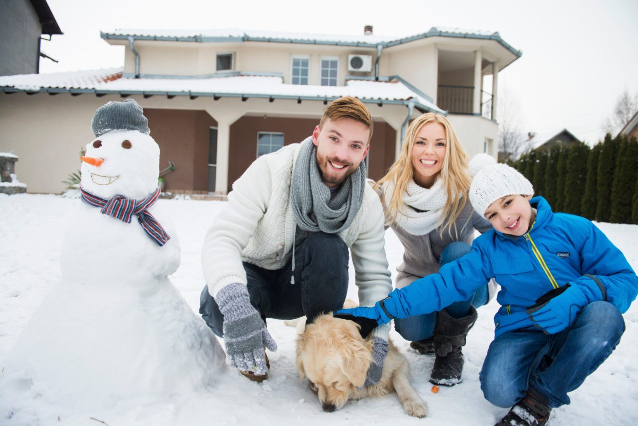 family_in_front_of_house_winter.jpg