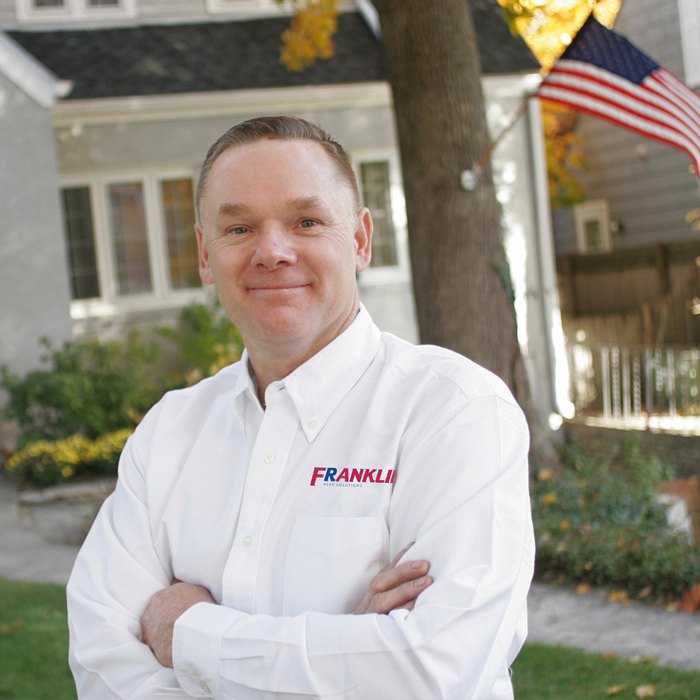 Franklin Pest Solutions Technician Outside Home